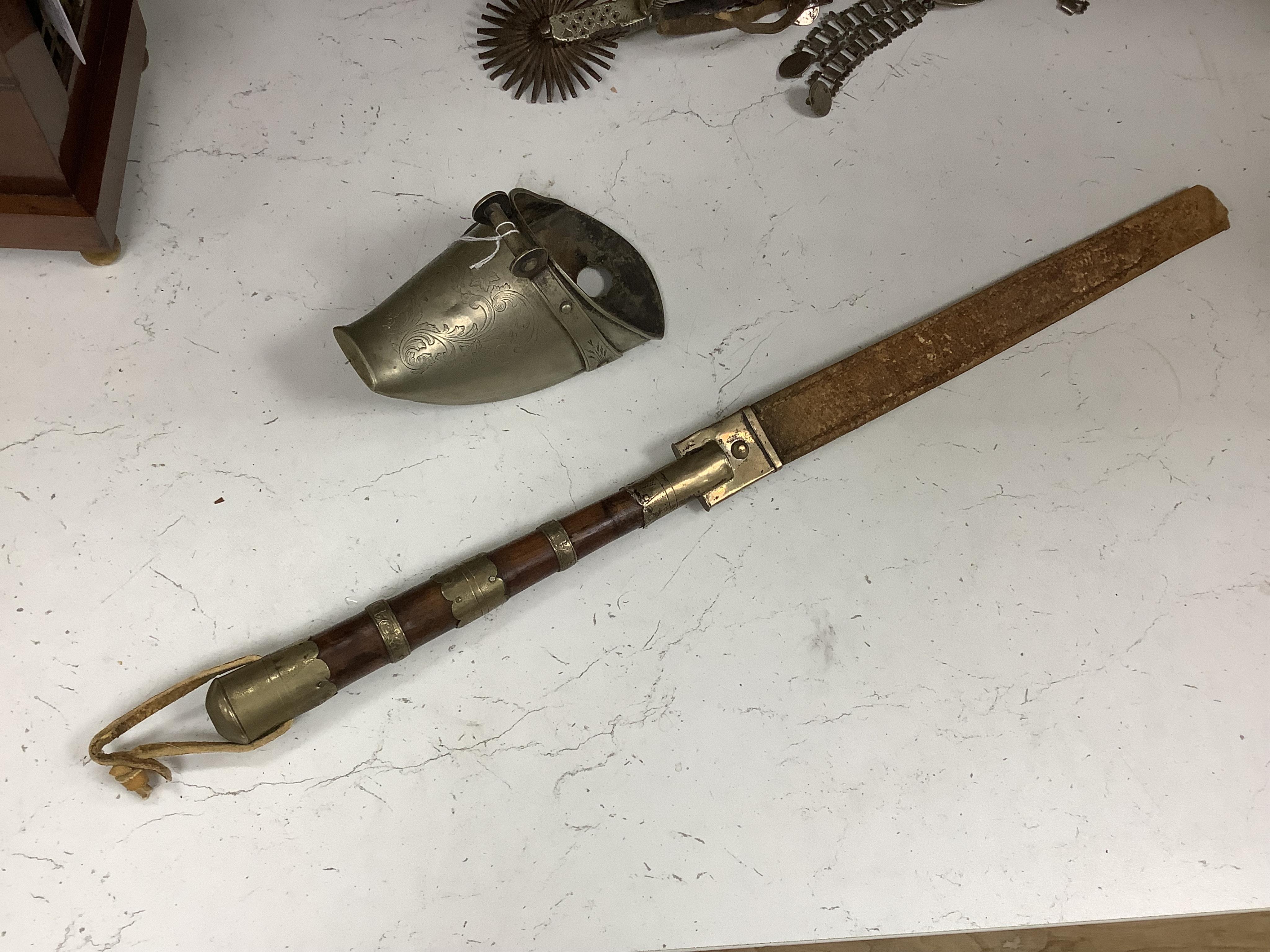 A group of Argentinian Gaucho spurs, bolas, bull whip, daggers and hanger, Longest 100cm